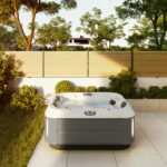 outdoor jacuzzi® hot tubs - the J-315 small hot tub on a patio during summer