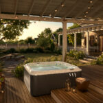 outdoor jacuzzi® hot tubs - a J-200 hot tub on a back deck with hanging lights